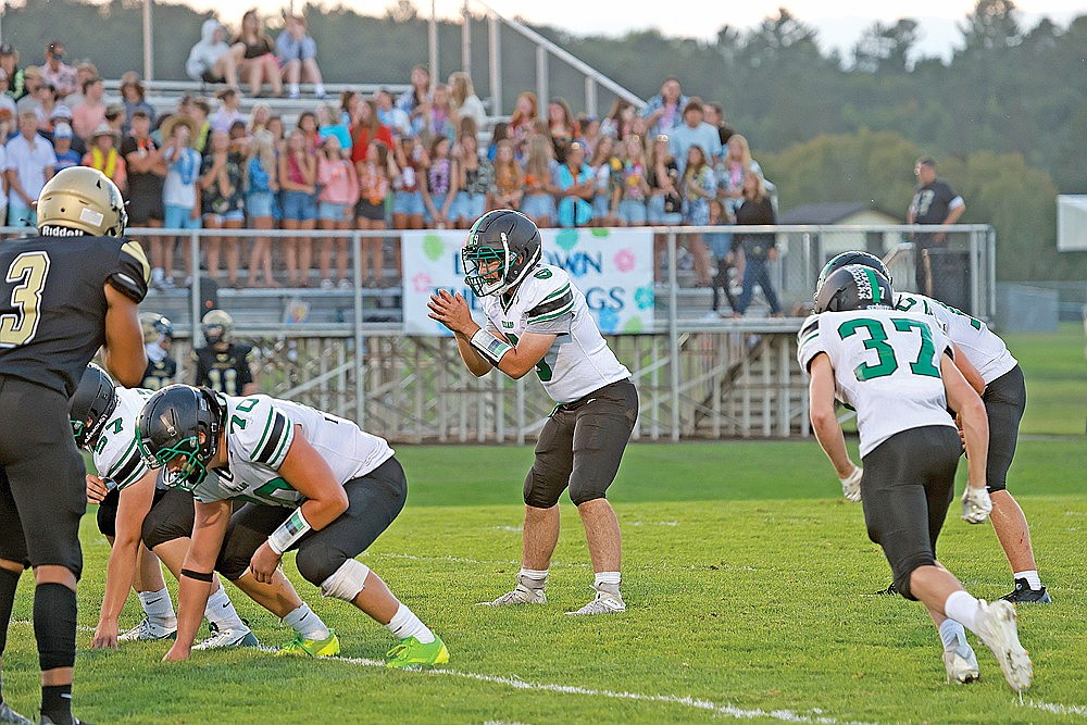 Rhinelander quarterback Chandler Servent prepares to take a snap during the second quarter of a non-conference football game at Hayward Friday, Aug. 30. Servent could be called upon to start at quarterback tonight if Truman Lamers is unable to play. Lamers is doubtful after sustaining an eye injury in last week’s win over the Hurricanes. (Bob Mainhardt for the River News)