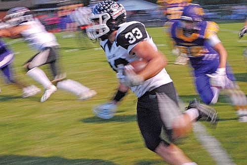 Noah Bruckner runs for a 15-yard touchdown in the second quarter of a 33-16 win over Ashland Friday, Aug. 30 at Oredocker Stadium. Bruckner ran for 236 yards and two touchdowns. (Photo by Brett LaBore/Lakeland Times)