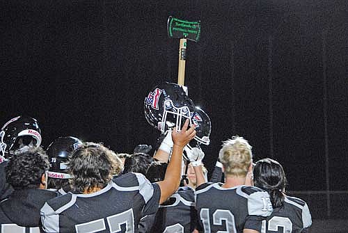 The Thunderbirds hold up the Axe following a 12-8 victory over Rhinelander Friday, Sept. 6 at IncredibleBank Field in Minocqua. The Thunderbirds have won the Axe three straight seasons. (Photo by Brett LaBore/Lakeland Times)