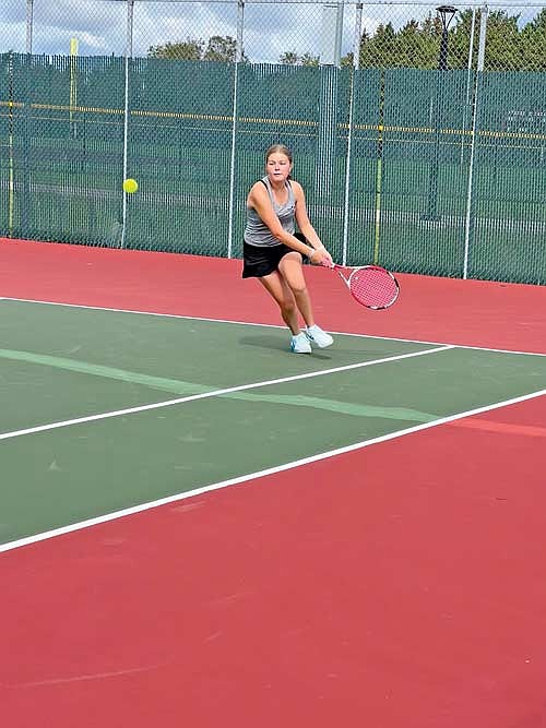Vella Walden plays the ball during a quad Friday, Sept. 6 at Baldwin-Woodville High School. Walden subbed in for Norah Strasburg, out sick, at No. 2 singles. Photo credit: Kim Olson. (Contributed photograph)