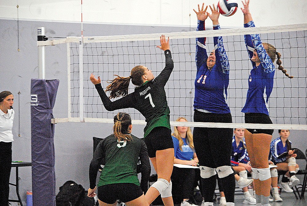 Rhinelander’s Ava Rathbun attempts to hit through a Northland Pines double block during a non-conference volleyball match in Ashland Saturday, Sept. 7. (Brett LaBore/Lakeland Times)