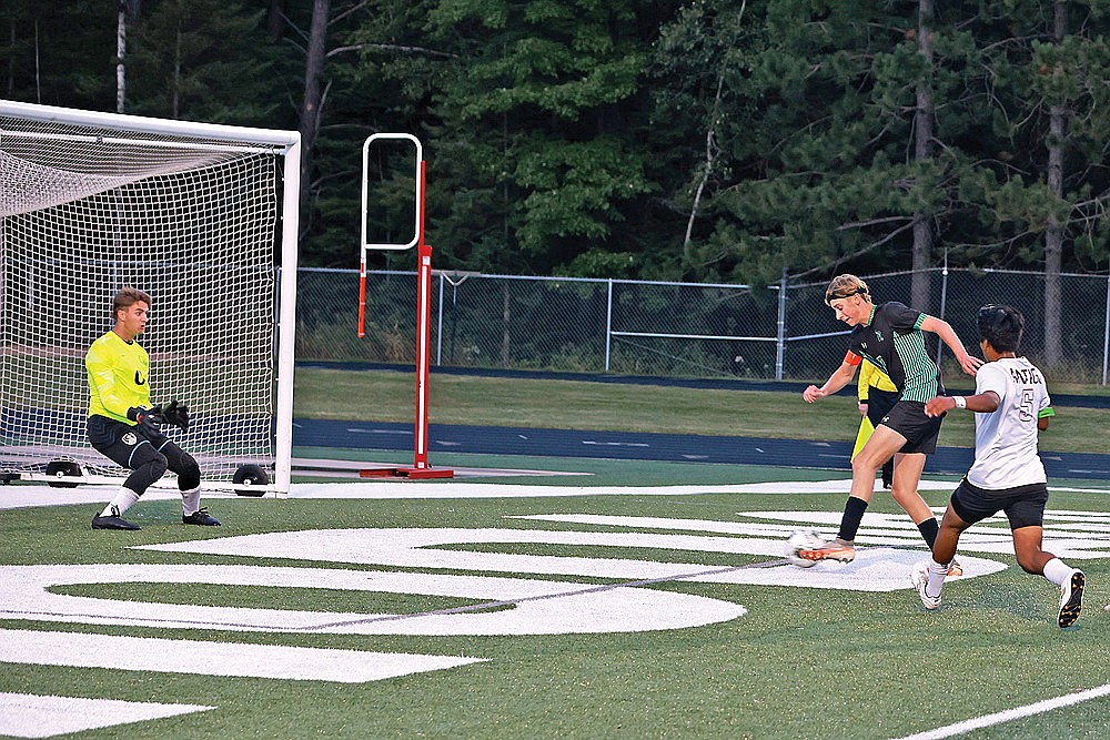 Rhinelander’s Michael Schiek redirects a rebound past Antigo goalkeeper Logan Griese during the first half of a GNC boys’ soccer game at Mike Webster Stadium Thursday, Sept. 5. Schiek scored on the play and the Hodags defeated the Red Robins, 3-1. (Bob Mainhardt for the River News)