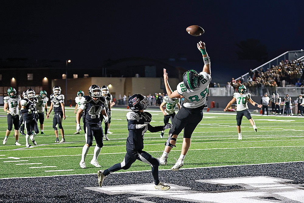Rhinelander’s Bo Stott makes a leaping attempt to catch a pass, covered by Lakeland’s Tyson Redman, at the end of the first half of a GNC football game in Minocqua Friday, Sept. 6. The Hodags fell to the T-Birds, 12-8. (Bob Mainhardt for the River News)