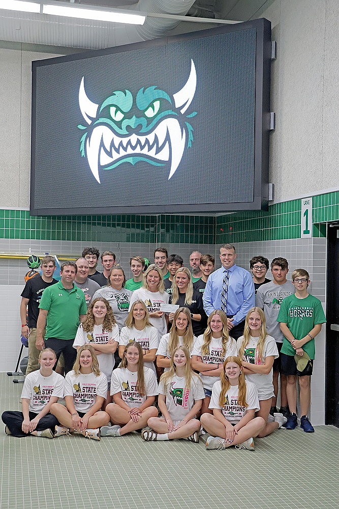 Pictured, the Hodag boys’ and girls’ swim teams accept the donation from the ABC. Coach Heck received the check from ABC board member Ali Shoeder. Also representing the ABC are Karaba, and board members Brett Aylesworth and Amanda Jorata. RHS activities director Brian Paulson represented the high school in the photograph. (Jeremy Mayo/River News)