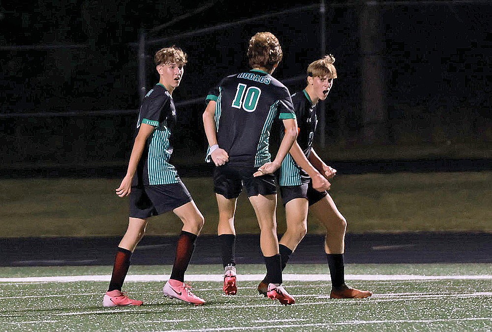 Rhinelander’s Michael Schiek, right, reacts with teammates Kamden Kostrova, left, and Charlie Johnson, middle, after scoring a goal in the final minute of a GNC boys’ soccer game against Mosinee at Mike Webster Stadium Tuesday, Sept. 10. The Hodags defeated Mosinee 2-0. (Bob Mainhardt for the River News)