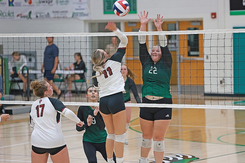 Rhinelander’s Libbey Buchmann puts up a block against Antigo’s Sydnie Heinzen during the first set of a GNC volleyball match at the Jim Miazga Community Gymnasium Tuesday, Sept. 10. (Bob Mainhardt for the River News)