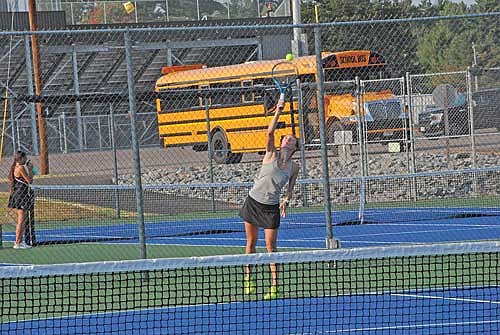 Elise Lamers serves the ball in her No. 3 doubles match against Antigo Thursday, Sept. 12 at the Lakeland Union High School tennis courts in Minocqua. Lakeland celebrated 13 seniors prior to their 7-0 win over Antigo. (Photo by Brett LaBore/Lakeland Times)