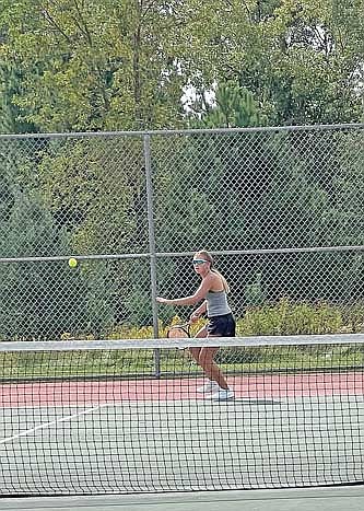 Katy Janowiec plays the ball during her No. 3 singles match in the Wausau West Invite Saturday, Sept. 14 at Wausau West High School. Janowiec won both of her matches at No. 3 singles. Photo credit: Kim Olson. (Contributed photograph)