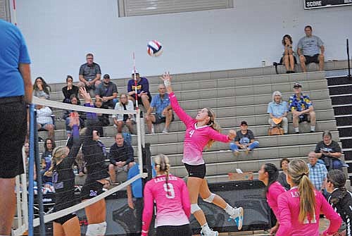 Stina Peterson tips the ball over the net for a kill in the first set against Mosinee Saturday, Sept. 21 at the Lakeland Union High School fieldhouse in Minocqua. (Photo by Brett LaBore/Lakeland Times)