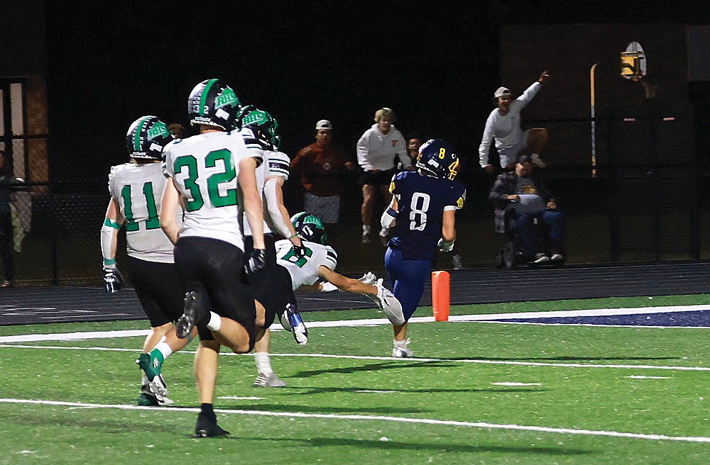 Tomahawk’s Landyn Seymour beats Rhinelander’s Rowan Wiczek to the end zone for a game-winning touchdown late in the fourth quarter of a GNC football game at Tomahawk Friday, Sept. 20. The Hatchets stunned the Hodags 21-14, scoring from 31 yards on a fake field goal with 3 seconds remaining in regulation. (Bob Mainhardt for the River News)