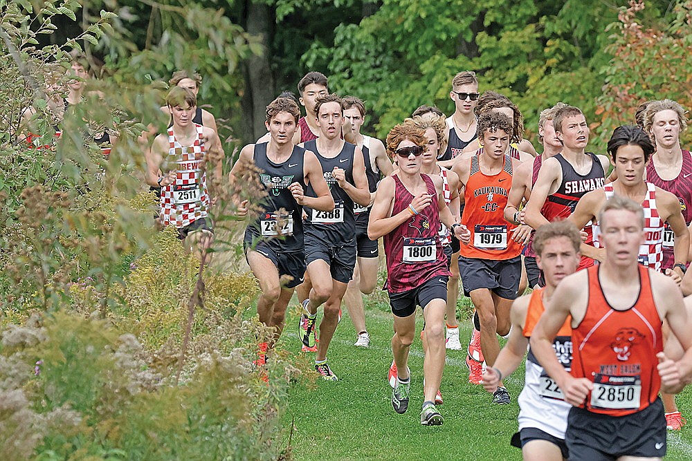 Rhinelander’s Greyson Gremban (2392) and Avrom Barr (2388) run together in the opening mile of the Bill Smiley Invitational cross country race in Wausau Saturday, Sept. 21. Gremban placed 10th overall in Division 1 while Barr was 18th in a field of 148 runners. (Jeremy Mayo/River News)