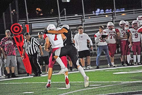 Carmelo Roche-Vetterneck tackles Medford’s Cash Thums for a loss in the fourth quarter against Medford Friday, Sept. 20 at IncredibleBank Field in Minocqua. (Photo by Brett LaBore/Lakeland Times)