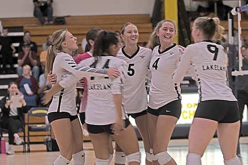 Thunderbirds, from left, Kieran Petrie, Greta Johnson, Tayiah Bauman, Sloane Timmerman, Stina Peterson and Cale Quade celebrate a point in the first set of a 3-0 win over Tomahawk Tuesday, Sept. 24 at the Tomahawk High School fieldhouse. It was Lakeland’s first win over the Hatchets in four years. (Photo by Brett LaBore/Lakeland Times)