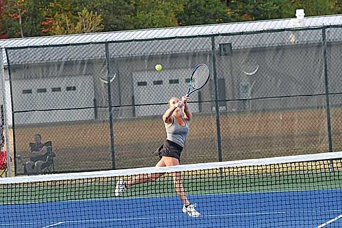 Norah Strasburg hits a backhanded, crosscourt groundstroke for a point in her No. 2 singles match against Merrill Tuesday, Oct. 1 at the Lakeland Union High School tennis courts in Minocqua. (Photo by Brett LaBore/Lakeland Times)