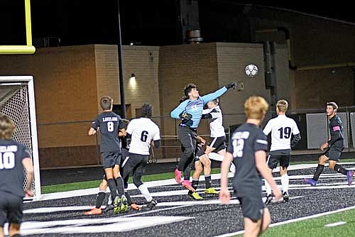 Talan Pockat punches the ball out of the box for a save in the first half against Mosinee Thursday, Oct. 3 at IncredibleBank Field in Minocqua. (Photo by Brett LaBore/Lakeland Times)