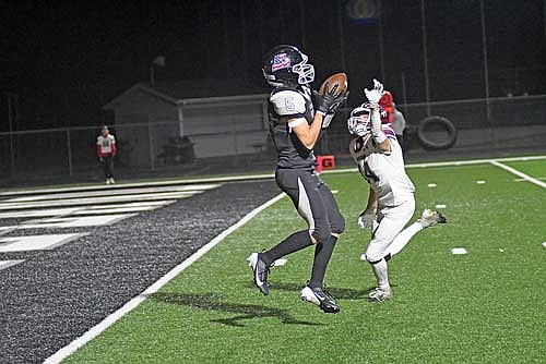 Evan Zoch catches a 24-yard touchdown pass with Antigo’s Ethan Buchman in coverage in the second quarter Friday, Oct. 4 at IncredibleBank Field in Minocqua. Zoch scored a total of five touchdowns. (Photo by Brett LaBore/Lakeland Times)