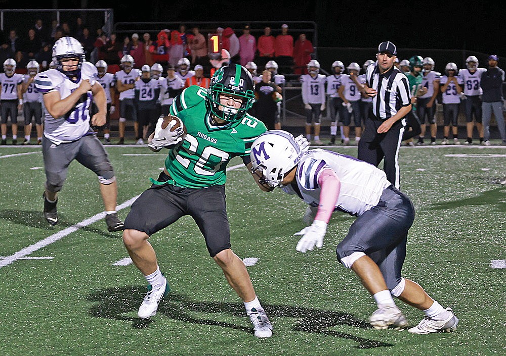 Rhinelander’s Myles Eagleson tries to evade a tackle attempt by Mosinee’s Jerrick Seeger during the first quarter of a GNC football game Friday, Oct. 4 at Mike Webster Stadium. Mosinee defeated Rhinelander 26-6 in the contest. (Bob Mainhardt for the River News)