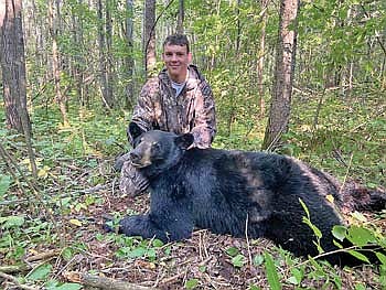 Tyson Skubal was able to bag this great bear on the third day of his hunt. Skubal was hunting on a tag donated to the Northwoods Youth Deer Hunt Challenge. He was hunting with a 30.06 that he won at the Challenge banquet last year. (Contributed photograph)