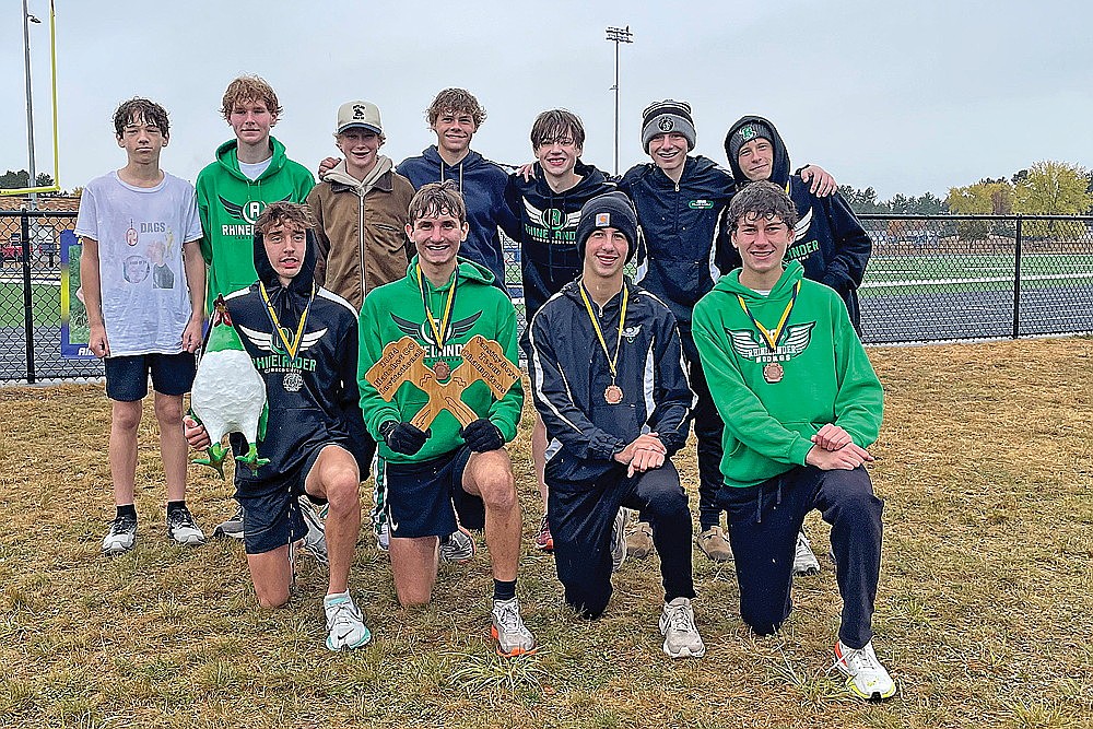 The Rhinelander High School boys’ cross country team poses with the championship plaque after winning the Hatchet Invite in Tomahawk Saturday, Oct. 12. Pictured in the front row, from left to right, are Avrom Barr, Greyson Gremban, Jackson Weinzatl and Brody Kowieski. In the back row are Chasin Wallmow, Jonathan Campbell, Hank Kowieski, Ayden Myers, Wyatt Crowell, Grant Gremban and Michael Brunette. (Jeremy Mayo/River News)