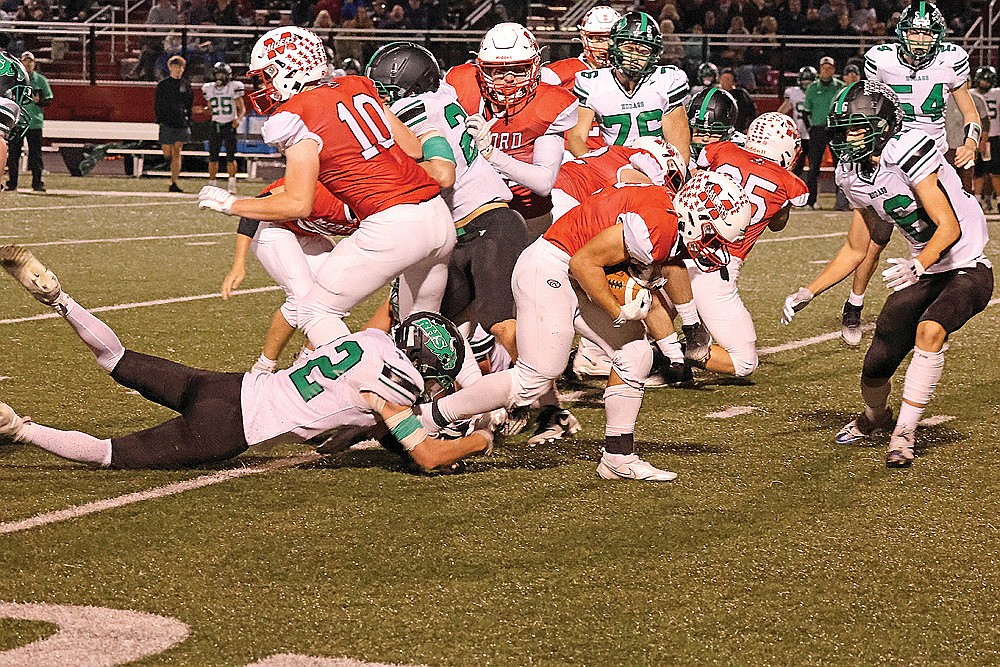 Rhinelander’s Truman Lamers attempts to tackle Medford’s Paxton Rothmeier during the second quarter of a GNC football game at Medford Thursday, Oct. 10. Rothmeier, the state’s leading rusher, ran for 311 yards and four touchdowns in Medford’s 43-13 win. (Matt Frey/Star News)