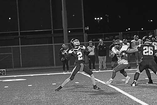 Deklan McQuade throws a 34-yard pass in the first quarter against Wausau East Friday, Oct. 11 at IncredibleBank Field in Minocqua. (Photo by Brett LaBore/Lakeland Times)