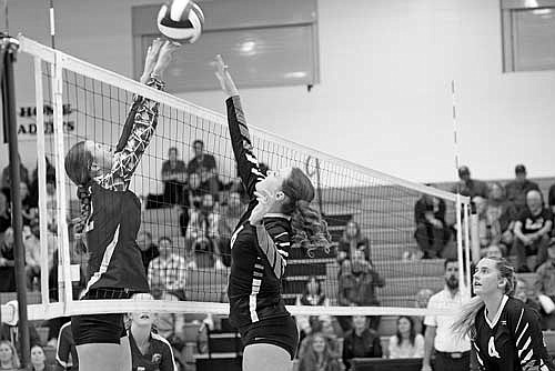 Mckaelynn Schettino, right, leaps for the ball against a Northland Pines player in the third set of a 3-0 win Tuesday, Oct. 15 at the Lakeland Union High School fieldhouse in Minocqua. (Photo by Brett LaBore/Lakeland Times)