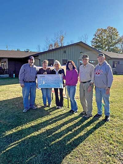 David Habighorst, Kelly Strauss, Linnea Ebann, Sue Harris, Mike Silber, and Pat Volk accept a $30,605 check from the Three Lakes Community Foundation to support the Three Lakes Veterans Memorial. The six are members of the ad hoc committee in charge of fundraising for the project. Groundbreaking is expected in the spring of 2025. (Submitted photo)