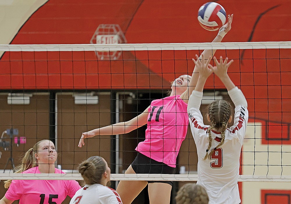 Rhinelander’s Kelsi Beran tips the ball against Crandon’s Alexis Boushka during a non-conference volleyball match in Crandon Thursday, Oct. 17. Beran recorded a match-high 14 kills as the Hodags swept the Cardinals in three sets. (Jeremy Mayo/River News)