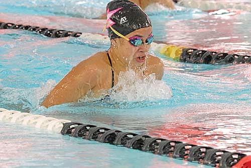 Olivia Mickle takes a breath in the 100 breaststroke against Medford Thursday, Oct. 17 at Medford Area High School. Mickle took first with a time of 1:12.83. (Photo by Matt Frey/Star News)