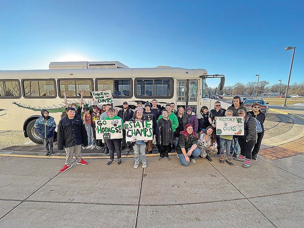 The School District of Rhinelander’s Special Olympics bowling team poses for a photograph before boarding the Hodag Bus to be paraded downtown Thursday, Dec. 6. The team sent 13 bowlers to the state Special Olympics bowling competition held Dec. 2-3 in Weston. All 13 placed, including four individual state champions. (Jeremy Mayo/River News)