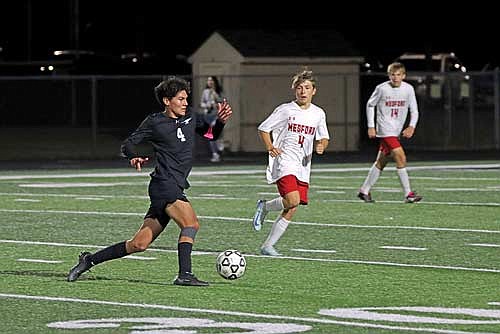 Dominic Gironella possesses the ball in a WIAA Division 3 regional semifinal game against Medford Thursday, Oct. 24 at IncredibleBank Field in Minocqua. (Photo by Kate Reichl/Lakeland Times)