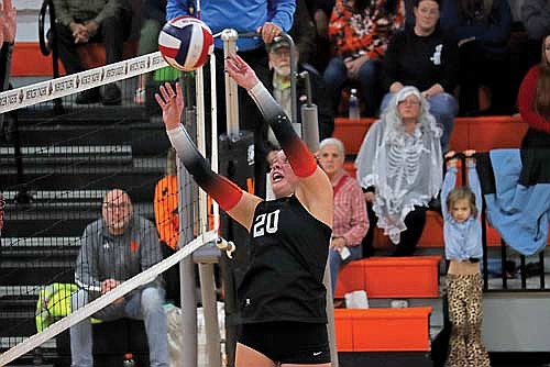 Jenny Klopatek plays the ball in a WIAA Division 5 sectional semifinal game against Prentice Thursday, Oct. 31 at John “JP” Pierpont Court in Mercer. Klopatek sustained an injury during the fourth set and came back to finish the game in the fifth set. (Photo by Brett LaBore/Lakeland Times)