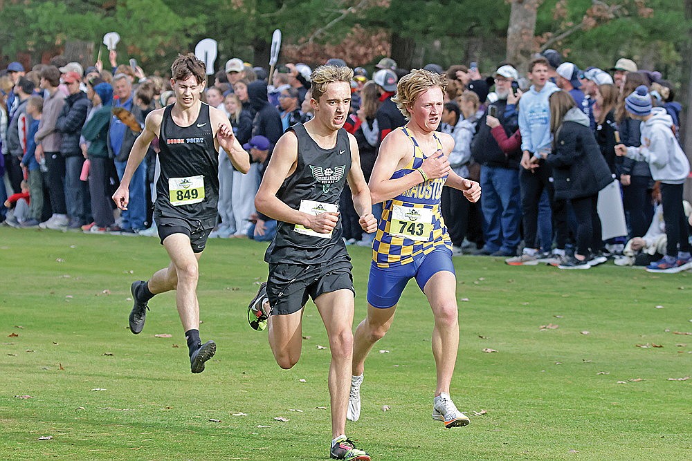 Rhinelander’s Avrom Barr battles Mauston’s Brekk Peterson to the finish of the WIAA Division 2 boys’ state cross country meet in Wisconsin Rapids Saturday, Nov. 2. (Jeremy Mayo/River News)