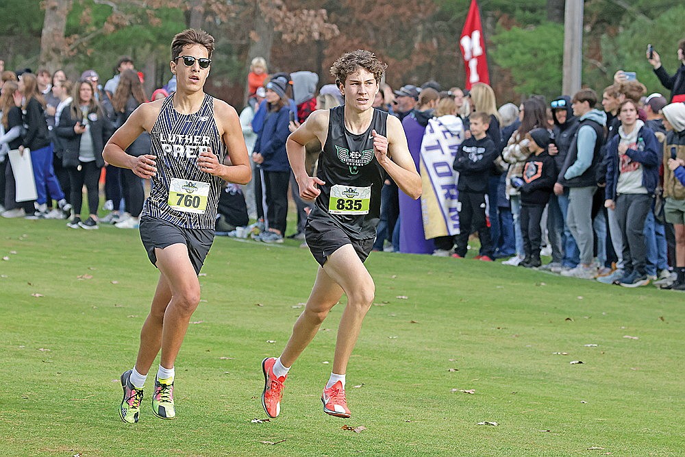 Rhinelander’s Brody Kowieski races Watertown Luther Prep’s Brian Duff to the finish of the WIAA Division 2 boys’ state cross country meet in Wisconsin Rapids Saturday, Nov. 2. (Jeremy Mayo/River News)