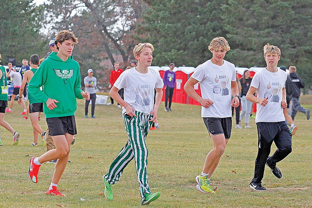 Rhinelander runners, from left to right, Brody Kowieski, Grant Gremban, Ayden Myers and Michael Brunette warm up prior to the start of the WIAA Division 2 boys’ state cross country meet in Wisconsin Rapids Saturday, Nov. 2. (Jeremy Mayo/River News)