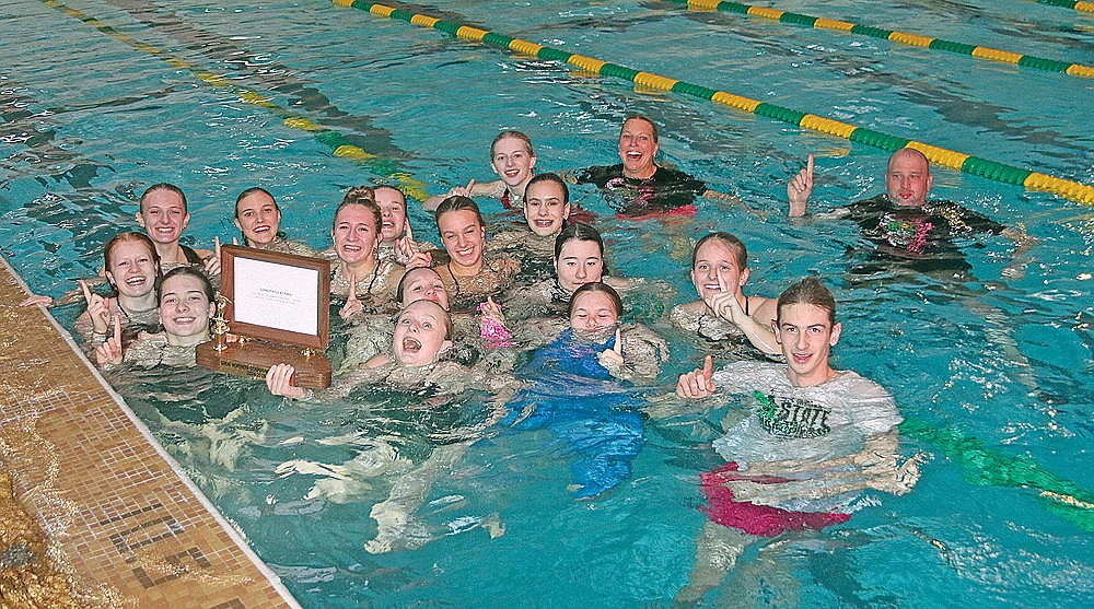 The Rhinelander High School girls’ swim team celebrates winning the Great Northern Conference championship in Colby Friday, Oct. 25. After winning its sixth straight GNC title, the Hodags are seeking their sixth straight WIAA D2 sectional title this Saturday in Menomonie. (Bob Mainhardt for the River News)