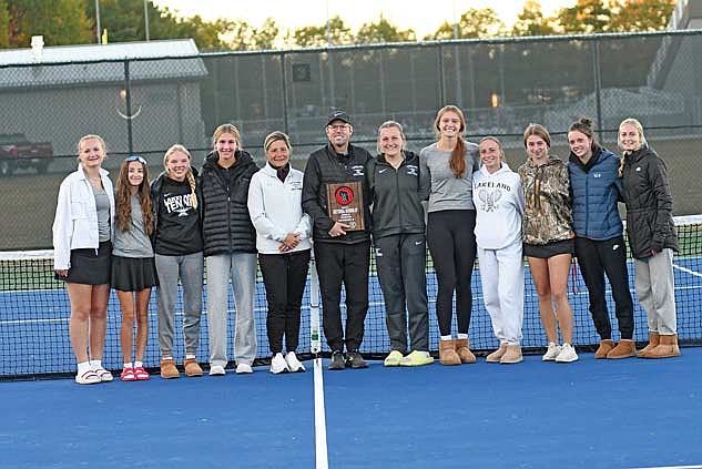 In this Oct. 9, 2024 file photo, the Lakeland Union High School (LUHS) girls’ tennis team, pictured from left, Ellie Baker, Sierra Wallace, Ali Timmerman, Alyssa Erickson, assistant coach Judy Jurries, coach Tom Oestreich, Sarah Barton, Kristina Ouimette, Norah Strasburg, Chance Jacobs, Elise Lamers and Lila Biller celebrate their sectional runner-up finish at a WIAA Division 2 sectional meet at the LUHS tennis courts in Minocqua. (Photo by Brett LaBore/Lakeland Times)