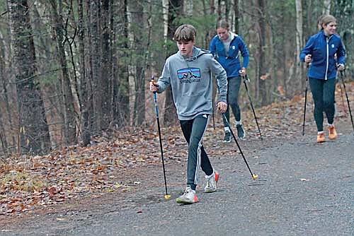 Jennings Kern goes through his workout with Katy Janowiec following Monday, Nov. 4 at Minocqua Winter Park. (Photo by Brett LaBore/Lakeland Times)