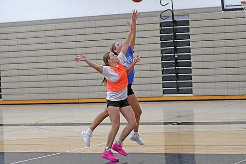 Sarah Barton contests the shot of Alyssa Erickson during practice Tuesday, Nov. 12 at the Lakeland Union High School fieldhouse in Minocqua.
(Photo by Brett LaBore/Lakeland Times)