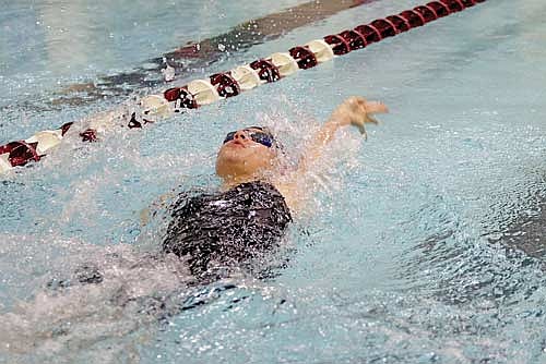 Avalon Collins swims the 100 backstroke at a WIAA Division 2 sectional meet Saturday, Nov. 9 at Menomonie High School. Tonight is Collins’ first time at state. (Photo by Jeremy Mayo/River News)