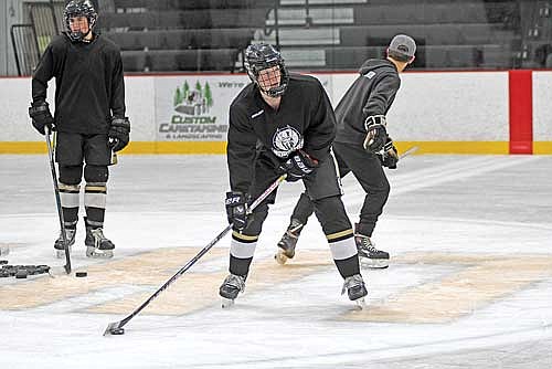 Joe Vizanko controls the puck during practice Thursday, Nov. 14 at the Lakeland Hawks Ice Arena in Minocqua. (Photo by Brett LaBore/Lakeland Times)