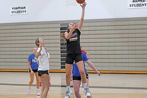 Kristina Ouimette makes a layup during practice Tuesday, Nov. 12 at the Lakeland Union High School fieldhouse in Minocqua. (Photo by Brett LaBore/Lakeland Times)