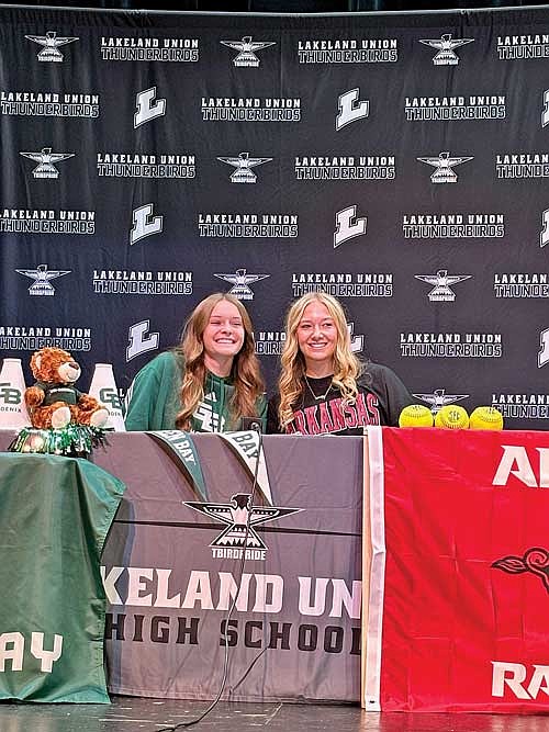 Kristina Ouimette, left, and Saylor Timmerman are all smiles during a National Signing Day ceremony Wednesday, Nov. 13 at the Lakeland Union High School theater in Minocqua. (Photo by Brett LaBore/Lakeland Times)