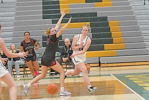 Cale Quade makes a pass to a teammate that results in a score in the second half against Westosha Central during the Beaver Dam Girls’ Basketball Showcase Friday, Nov. 22 at Beaver Dam High School. (Photo by Brett LaBore/Lakeland Times)