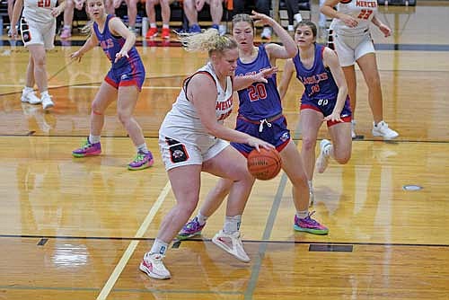 Eiley Schoeneman dribbles against the defense of Northland Pines’ Kaydence Brost during the first half Thursday, Nov. 21 at Coach Leverson Court in Mercer. (Photo by Brett LaBore/Lakeland Times)