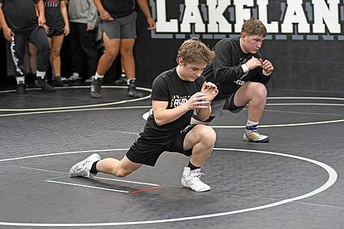 Evan Hastreiter, front, and Zac Amershek go through a drill during practice Monday, Nov. 18 at the Lakeland Union High School wrestling room in Minocqua. (Photo by Brett LaBore/lakeland Times)