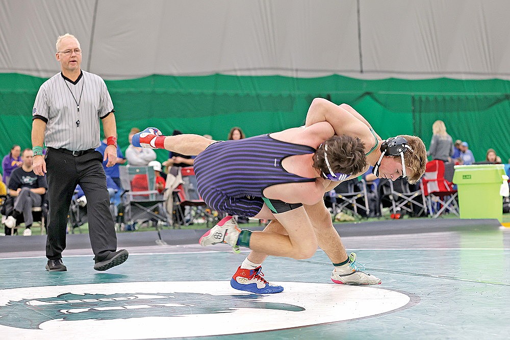 In this Dec. 21, 2023 file photo, Rhinelander’s Logan Schwinger throws Ashland’s Christopher Craig to the mat during the Hodag Scramble wrestling tournament in the Hodag Dome. Schwinger is the reigning GNC champion at 190 pounds as he went 36-13 overall for the Hodags last season. (Bob Mainhardt for the River News)