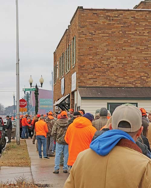 Hundreds of hunters make the stop in Tomahawk every year for the Annual Tomahawk Venison Feed. The line stretches down the block before the grills open up. (Photo by Beckie Gaskill/Lakeland Times)