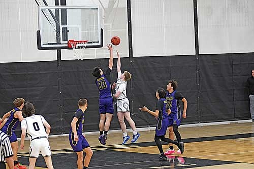 Jackson Burnett scores a basket with the foul against Ashland’s Gavin Greene in the second half Monday, Dec. 2 at Ted Voigt Court in Minocqua. Burnett scored a career-high 23 points. (Photo by Brett LaBore/Lakeland Times)