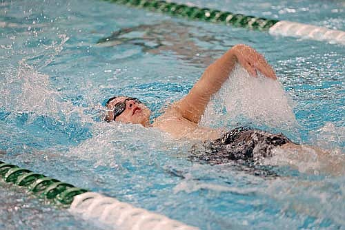 Garrison Jacques goes through the 100 backstroke against Rhinelander Thursday, Dec. 5 at the Heck Family Community Pool in Rhinelander. (Photo by Bob Mainhardt for the River News)